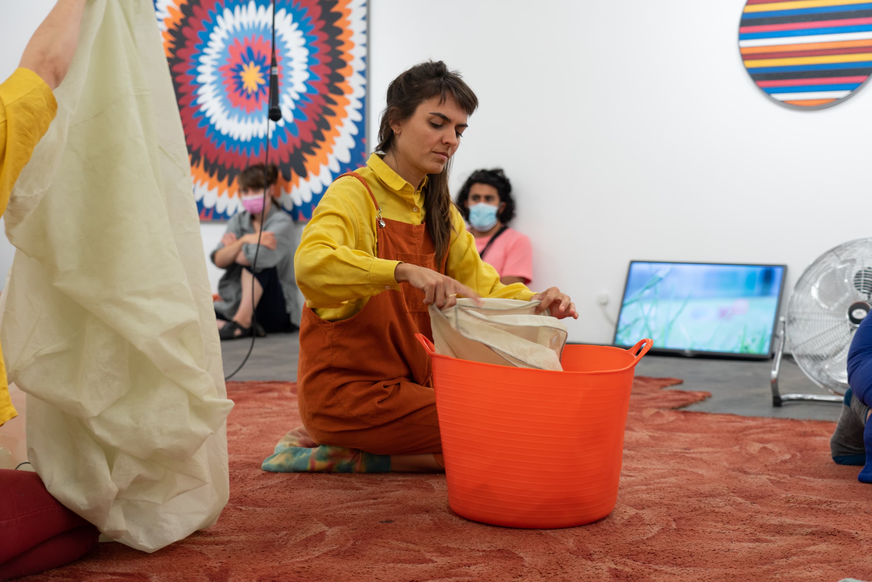 Still from the performance of Alice Gale-Feeny performing her work - Begin in the Middle (Neither Me nor the Bucket)