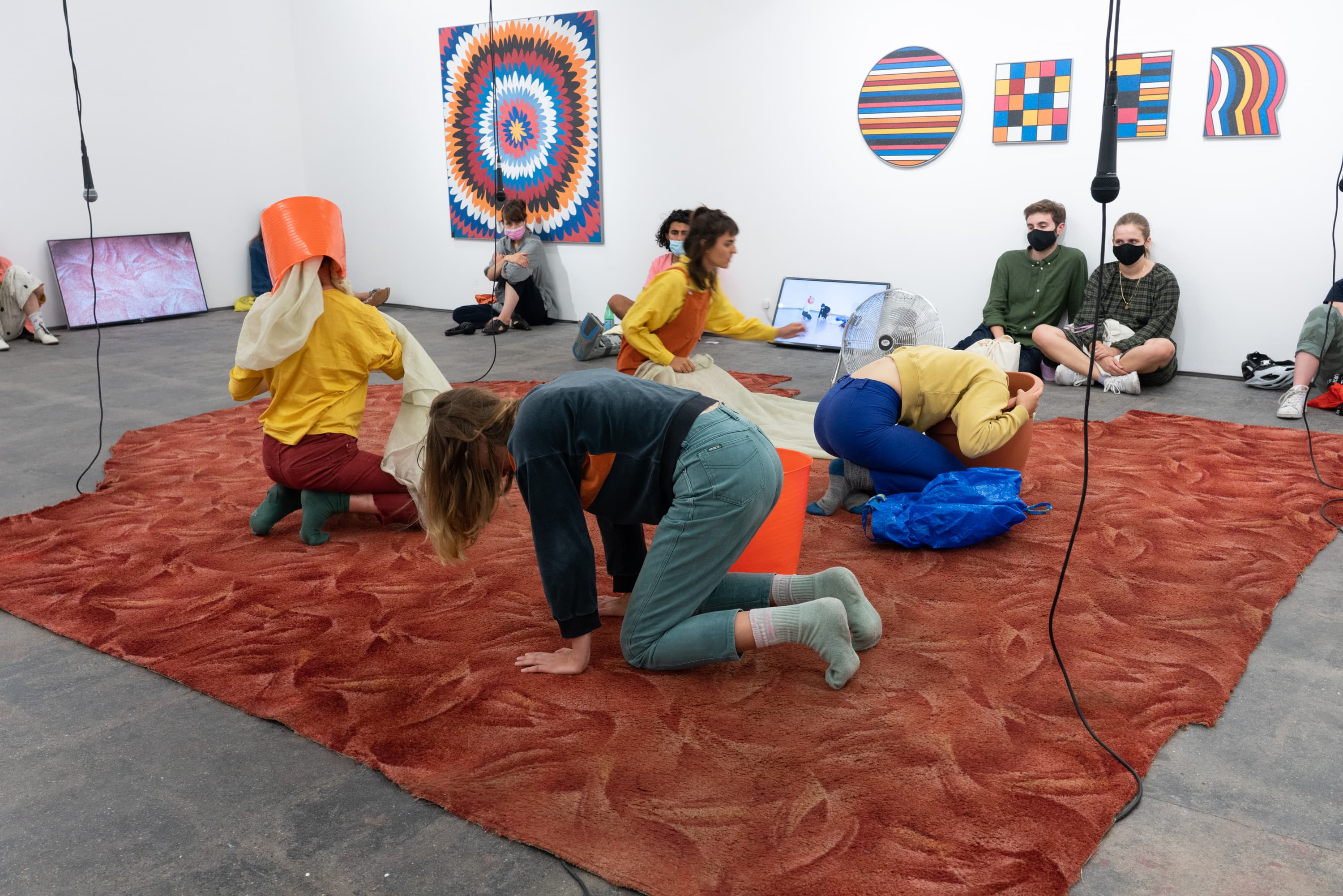 Still from the performance of Alice Gale-Feeny performing her work - Begin in the Middle (Neither Me nor the Bucket)