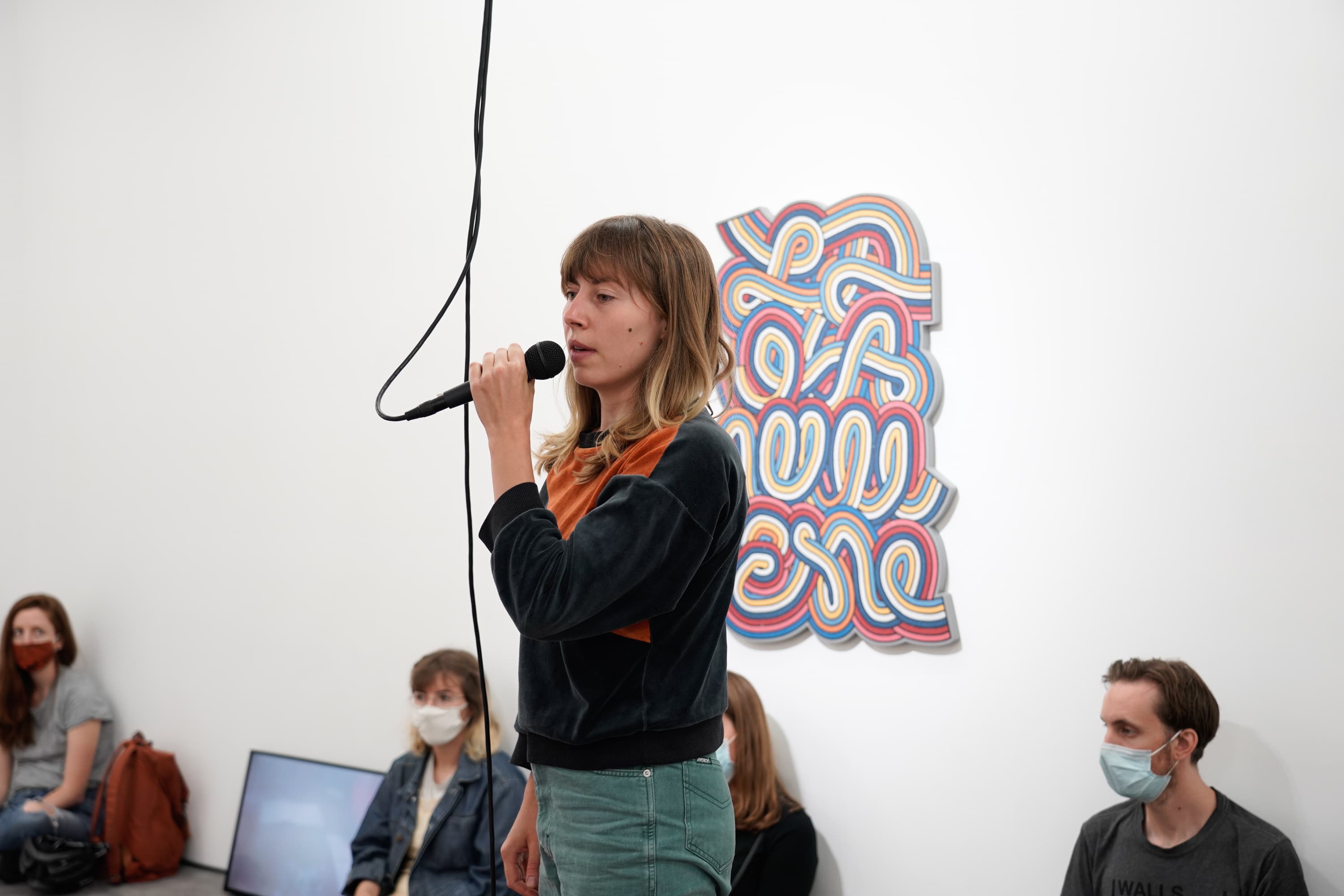 Still from the performance of Alice Gale-Feeny performing her work - Begin in the Middle (Neither Me nor the Bucket)