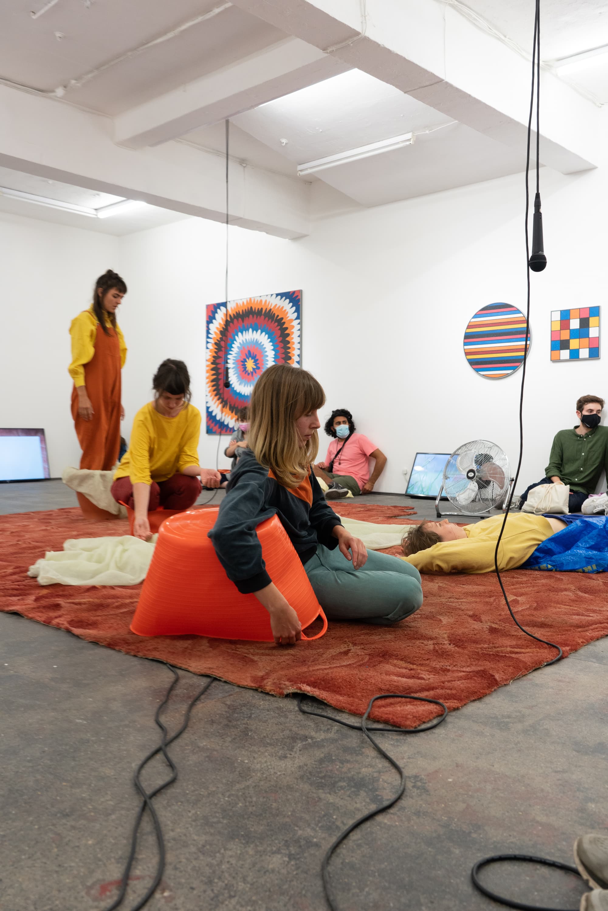 Still from the performance of Alice Gale-Feeny performing her work - Begin in the Middle (Neither Me nor the Bucket)