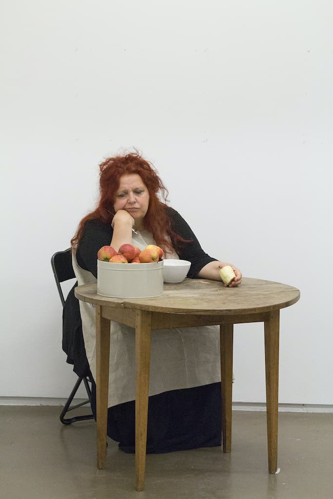 Performance still from Woman Peeling Apples