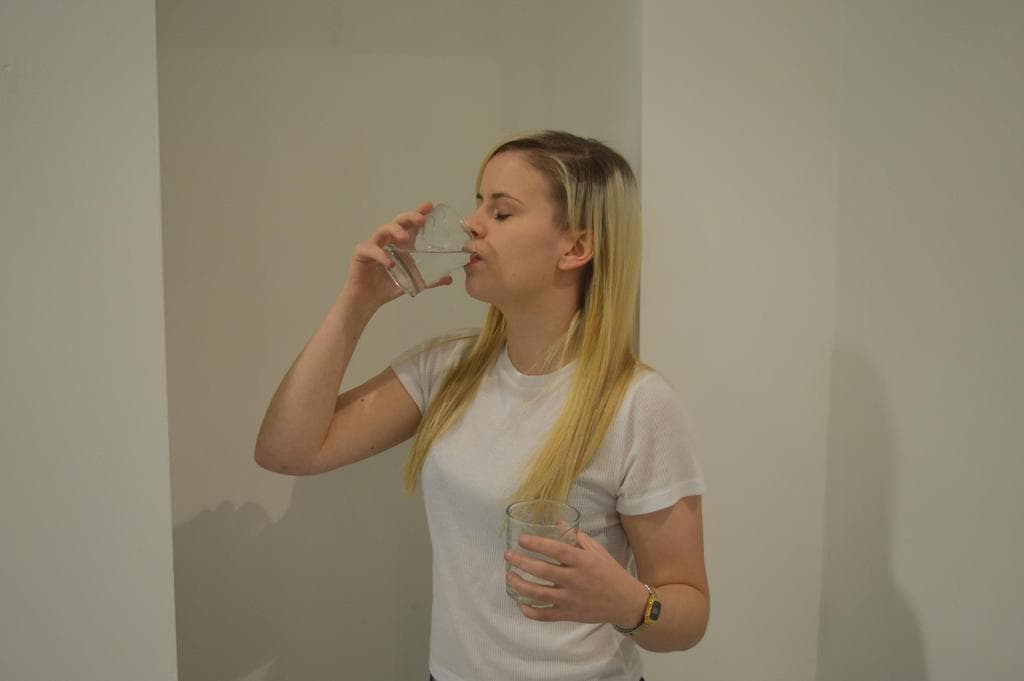Performance still from Woman Pouring Water in Glass