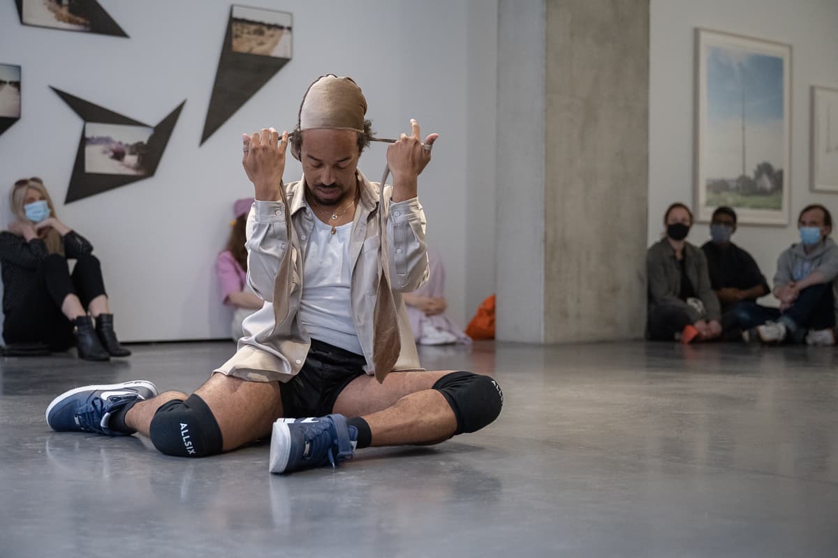 The artist Paul Maheke performing Taboo Durag at Goodman Gallery